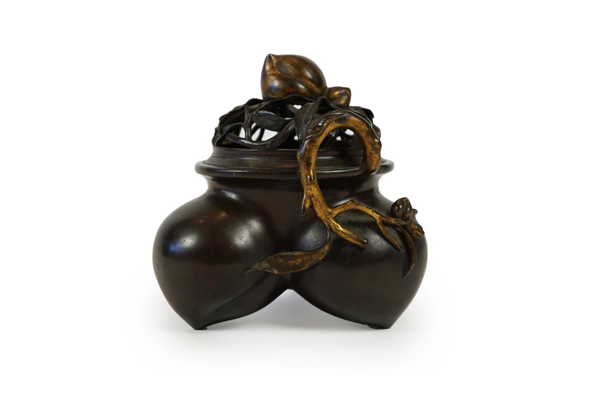 A large Chinese bronze and parcel gilt ‘peach’ censer and cover, Li, 17th/18th century